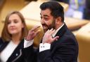 Scottish First Minister Humza Yousaf reacts as he answers questions during First Minister's Questions at Scottish Parliament at the Scottish Parliament Building on April 25, 2024