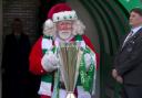 Santa appears with the League Trophy
