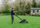 David Hedged-Gower mows the lawn.