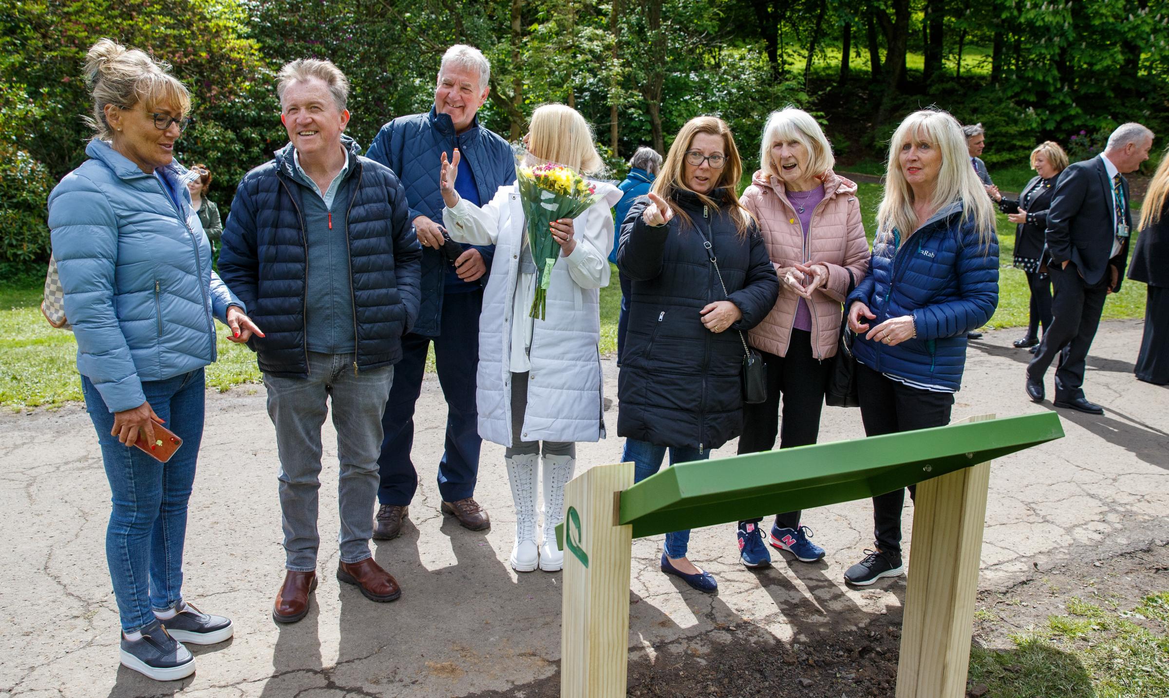 Opening of The Herald I Remember national Covid memorial at Pollok country park. People pictured at Birch grove in Pollok Country Park. Birch grove is one of the areas in the park where artist Alec Finlay has installed supports as part of the I Remember