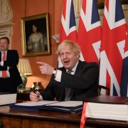 Lord Frost pictured with Boris Johnson as the former Prime Minister signs the Brexit deal with the EU.
