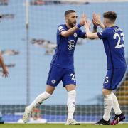 MANCHESTER, ENGLAND - MAY 08: Hakim Ziyech of Chelsea celebrates with team mate Billy Gilmour (R) after scoring their side's first goal during the Premier League match between Manchester City and Chelsea at Etihad Stadium on May 08, 2021 in Manchester,