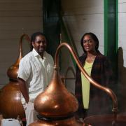 Matugga Rum’s Paul and Jacine Rutasikwa with their Jamaican-style copper pot distiller