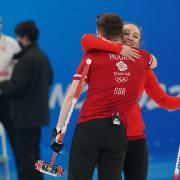 Great Britain's Jennifer Dodds and Bruce Mouat celebrate winning their mixed doubles match against Canada