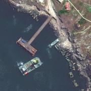 This satellite image provided by Maxar Technologies shows a closer view of barge, serna class landing craft and sunken serna craft near Snake Island in the Black Sea Thursday, May 12, 2022. (Satellite image Â©2022 Maxar Technologies via AP).