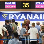 Passengers queue at Ryanair check-in counters at the airport in Valencia on July 25, 2018 as the airline's cabin crew began a two-day strike. Photo Jose Jordan AFP/Getty Images).