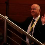 Peter Murrell, Nicola Sturgeon's husband as she is voted in as the new SNP leader at the party's annual conference at Perth Concert Hall, Scotland in November 2014.  Photo Andrew Milligan/PA
