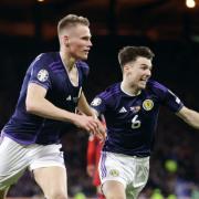 Scott McTominay's double saw Scotland defeat Spain at a raucous Hampden Park.