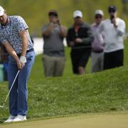 Justin Rose, of England, chips to the green on the 17th hole during the second round of the PGA Championship golf tournament at Oak Hill Country Club on Friday, May 19, 2023, in Pittsford, N.Y. (AP Photo/Seth Wenig).