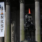 Banksy named the traffic cone topped status as his 