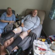 Robert Stone (pictured with his daughter, Carol, at home in Arrochar) was supposed to undergo a knee replacement in April but it was cancelled pending the results of a second ECG. He is still waiting for an appointment for the scan