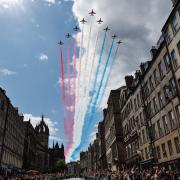 The Red Arrows fly over the Royal Mile