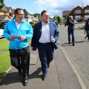 Craig Hoy, left, and Thomas Kerr campaigning in Rutherglen for the Scottish Conservatives.