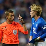Rangers playmaker Todd Cantwell is reprimanded by referee Clement Turpin at Ibrox last night