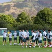 Celtic manager Brendan Rodgers, left, speaks to his players during training at Lennoxtown yesterday