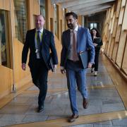 SNP Health Secretary Neil Gray has blamed financial pressures for pausing hospital building projects