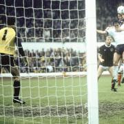Richard Gough rises above England's Kenny Sansom to win the 1984 Rous Cup for Scotland.