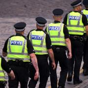 Police officers  on the streets of Edinburgh  in July