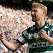 Liam Scales celebrates a Celtic goal at Parkhead