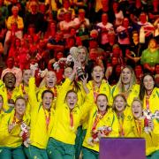 Australia celebrate with the trophy after the 2023 Netball World Cup final in Cape Town (PA)