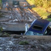 A car is seen on a bridge washed away near Dundee following yesterdays torrential rain as Storm Babet batters the country