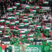 Celtic fans wave Palestinian flags during their Uefa Champions League match against Atletico Madrid at Celtic Park last week in a display organised by the Green Brigade