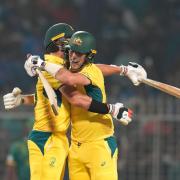 Australia captain Pat Cummins and Mitchell Starc celebrate victory (Aijaz Rahi/AP).