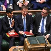 Chancellor Jeremy Hunt is congratulated by colleagues after delivering his Autumn Statement