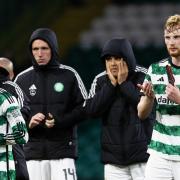 Celtic centre half Liam Scales, right, applauds the Parkhead club's fans after the defeat to Hearts last week