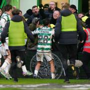 Paulo Bernardo celebrates with the Celtic fans after hitting the opening goal against Rangers.