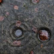 A cup and ring stone at the edge of the battery storage site. Image: Colin Mearns