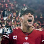 San Francisco 49ers quarterback Brock Purdy celebrates with the trophy after their win against the Detroit Lions in the NFC Championship (Godofredo A Vasquez/AP)