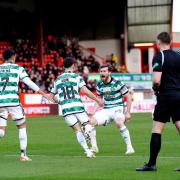 Nick Kuhn celebrates with his Celtic teammates after scoring at Pittodrie, but he says a draw wasn't good enough.