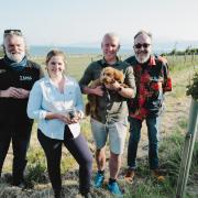Si King and Dave Myers, outside left and right, visit a truffle-growing couple and their dog on Bute