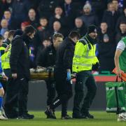 Martin Boyle is stretchered off the pitch