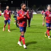 The Rangers players are booed off the park by their own supporters at Dens Park last night after their 0-0 draw with Dundee