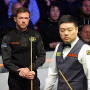 Jack Lisowski, left, leads Ding Junhui after an entertaining opening session (Martin Rickett/PA)