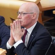 John Swinney, pictured in the Scottish Parliament yesterday, is considering standing for the positions of SNP leader and First Minister