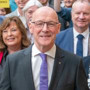 SNP MSP John Swinney with supporters on Thursday as he announced his bid for the SNP leadership