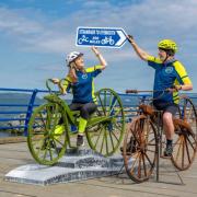A sculpture of the world's first pedal bike has been unveilled at the start point of a cycle route named after its inventor