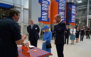 The Duke of Cambridge, known as the Earl of Strathearn in Scotland, tries Irn-Bru as Queen Elizabeth II looks on. Andrew Milligan (PA)
