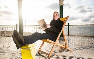 Actor James Nesbitt with the final edition of the Yellow Pages