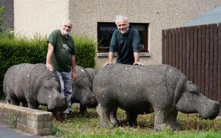 Stan and Mark Bonnar in Glenrothes with the concrete hippos made by Stan in the 1970s. Picture: BBC/Objective Media