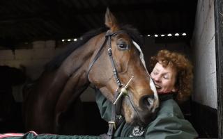 Grand National winner One For Arthur pictured with trainer Lucinda Russell at her yard in Kinross