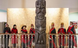 The delegation from the Nisga'a nation beside the 11-metre tall memorial pole during a visit to the National Museum of Scotland in Edinburgh, ahead of the return of 11-metre tall memorial pole to what is now British Columbia