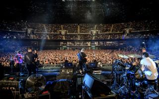 New Order performing at the OVO Hydro