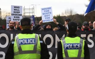 Members of the Patriotic Alternative far-right group clash with campaigners outside an asylum hotel in Erskine