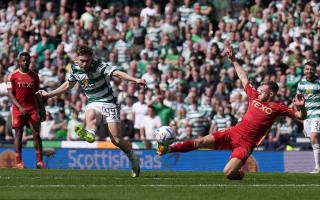 Celtic winger James Forrest curls his team into the lead against Aberdeen at Hampden.