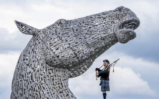 Piper Mark Sutherland, from Larbet, plays during a special event day to celebrate the 10th anniversary of the Kelpies sculpture in Falkirk