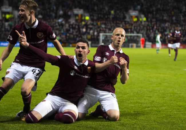 Steven Naismith and his Hearts team-mates celebrate the winning goal over Hibs